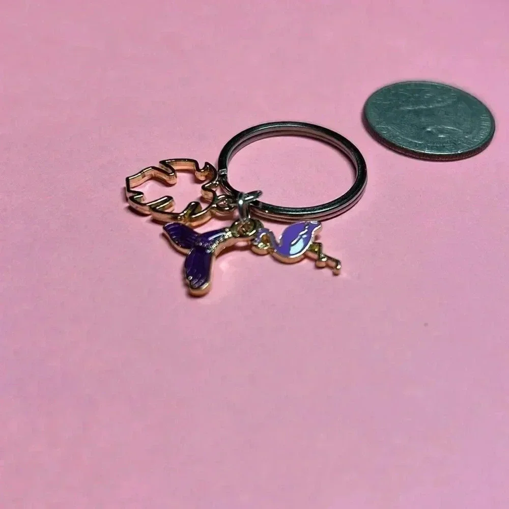 Silver keychain with charms‎